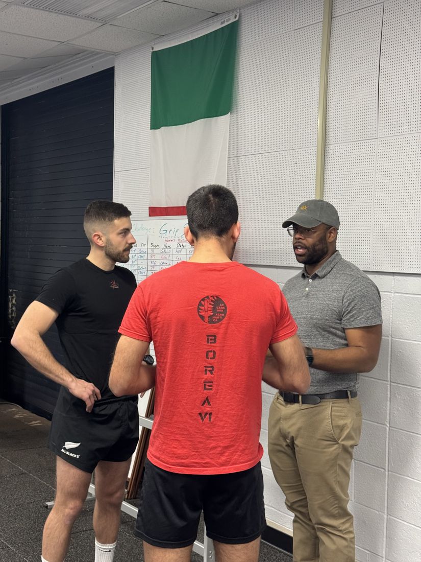 Markus Hawkins coaching athletes in a training facility